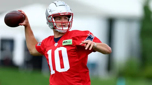 Drake Maye #10 of the New England Patriots makes a pass during the New England Patriots OTA Offseason Workout on May 29, 2024 in Foxborough, Massachusetts.