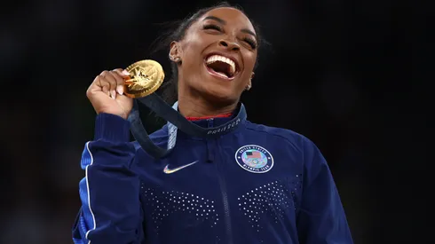 Gold medalist Simone Biles of Team United States celebrates on the podium during the medal ceremony for the Artistic Gymnastics Women's Vault Final on day eight of the Olympic Games Paris 2024 at Bercy Arena on August 03, 2024 in Paris, France.