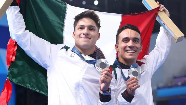 Silver Medalists Juan Manuel Celaya Hernandez and Osmar Olvera Ibarra of Team Mexico pose following the Diving medal ceremony after the Men's Synchronised 3m Springboard Final on day seven of the Olympic Games Paris 2024 at Aquatics Centre on August 02, 2024 in Paris, France.