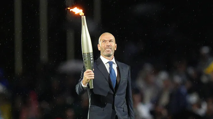 Zinedine Zidane holding the Olympics torchZinedine Zidane holding the Olympics torch