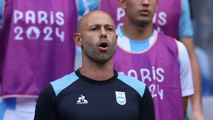 Javier Mascherano, Head Coach of Team Argentina sings the national anthem.