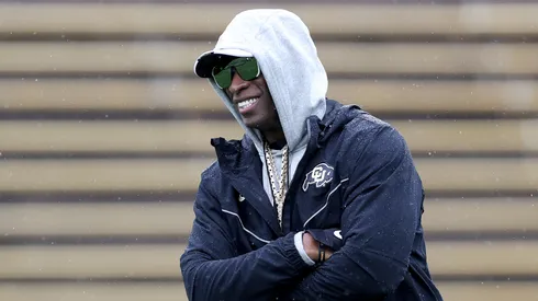 Head coach Deion Sanders of the Colorado Buffaloes watches as his team warms-up prior to their spring game at Folsom Field on April 27, 2024 in Boulder, Colorado.
