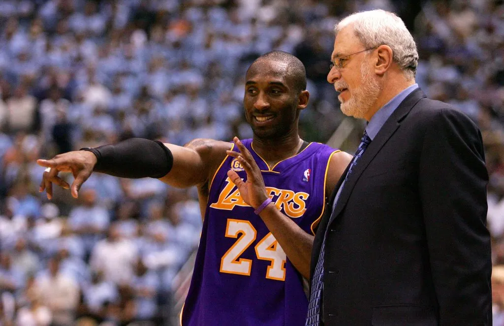 Kobe Bryant #24 of the Los Angeles Lakers talks with Head Coach Phil Jackson against the Utah Jazz. Jonathan Ferrey/Getty Images