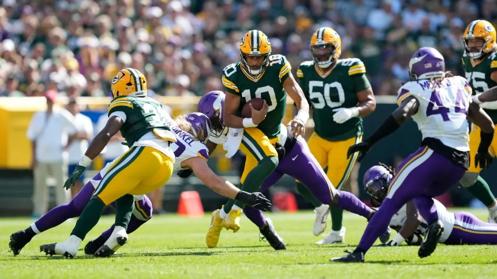 Jordan Love #10 of the Green Bay Packers carries the ball against the Minnesota Vikings during the second quarter of the game at Lambeau Field on September 29, 2024 in Green Bay, Wisconsin.