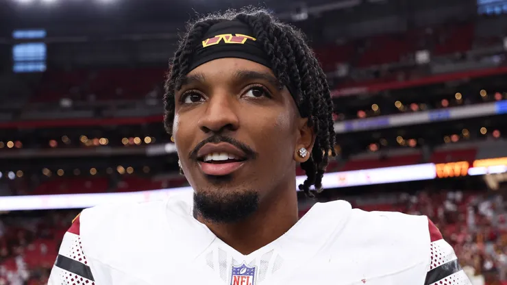 Jayden Daniels #5 of the Washington Commanders reacts after defeating the Arizona Cardinals 42-14 at State Farm Stadium on September 29, 2024 in Glendale, Arizona.