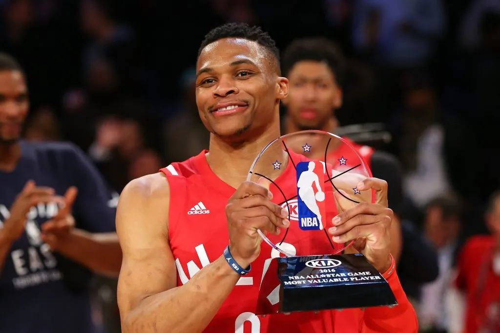 Russell Westbrook #0 of the Oklahoma City Thunder and the Western Conference holds the NBA All-Star MVP trophy. Elsa/Getty Images