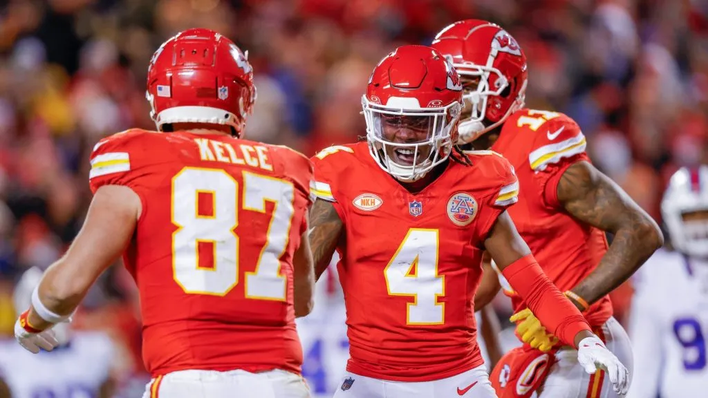 Rashee Rice #4 of the Kansas City Chiefs reacts with Travis Kelce #87 after scoring a touchdown during the second half of the game against the Buffalo Bills at GEHA Field at Arrowhead Stadium on December 10, 2023 in Kansas City, Missouri.