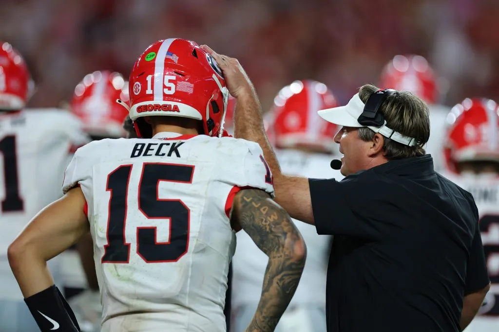 TUSCALOOSA, ALABAMA – SEPTEMBER 28: Head coach Kirby Smart of the Georgia Bulldogs speaks to Carson Beck #15 during the fourth quarter against the Alabama Crimson Tide at Bryant-Denny Stadium on September 28, 2024 in Tuscaloosa, Alabama. (Photo by Kevin C. Cox/Getty Images)