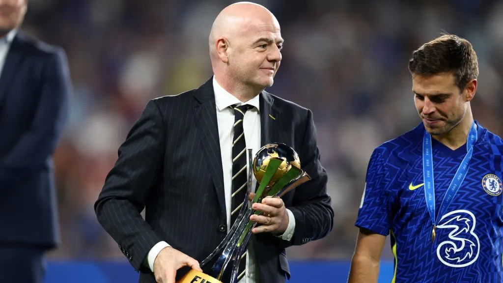 FIFA President, Gianni Infantino hands over the FIFA Club World Cup trophy to Cesar Azpilicueta of Chelsea following the FIFA Club World Cup UAE 2021 Final match between Chelsea and Palmeiras at Mohammed Bin Zayed Stadium on February 12, 2022 in Abu Dhabi, United Arab Emirates.