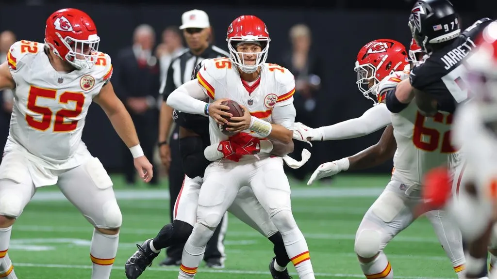 Patrick Mahomes #15 of the Kansas City Chiefs is pressured by Arnold Ebiketie #17 of the Atlanta Falcons during the second quarter at Mercedes-Benz Stadium on September 22, 2024 in Atlanta, Georgia.