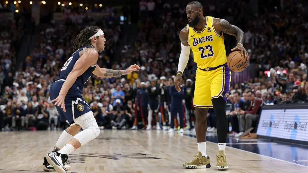 Aaron Gordon #50 of the Denver Nuggets guards LeBron James #23 of the Los Angeles Lakers in the third quarter during game five of the Western Conference First Round Playoffs at Ball Arena. (Photo by Matthew Stockman/Getty Images)