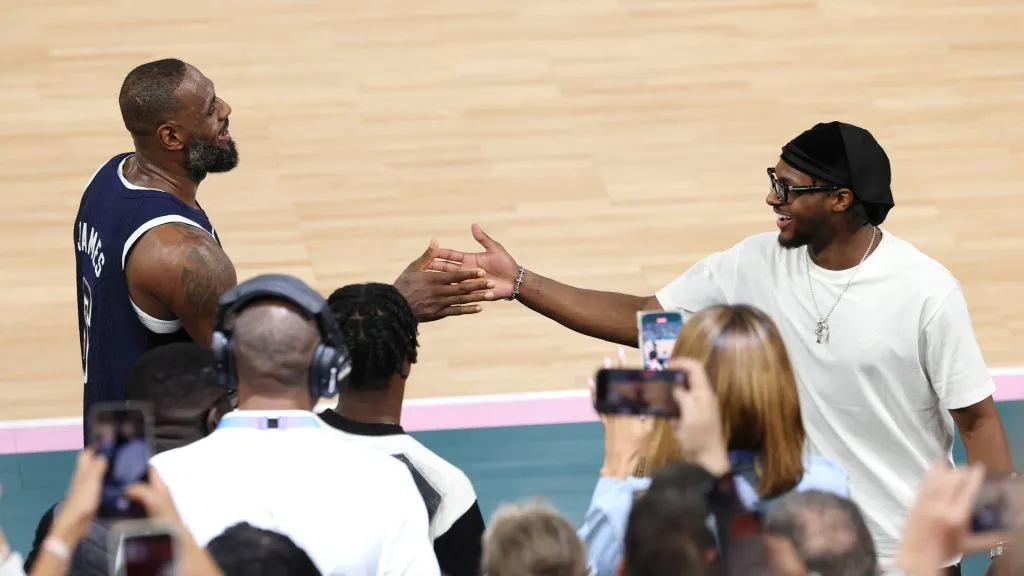 LeBron James #6 of Team United States high fives his son and NBA player Bronny James after Team United States’ victory against Team France during the Men’s Gold Medal game between Team France and Team United States on day fifteen of the Olympic Games Paris 2024 at Bercy Arena on August 10, 2024 in Paris, France. (Photo by Jamie Squire/Getty Images)