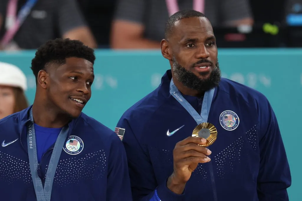 Anthony Edwards and LeBron James pose with their medals on the podium. Jamie Squire/Getty Images