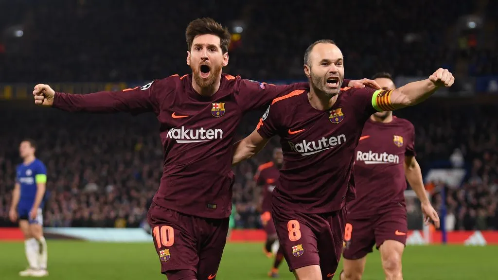Lionel Messi of Barcelona celebrates his equaliser with team mate Andres Iniesta during the UEFA Champions League Round. Mike Hewitt/Getty Images