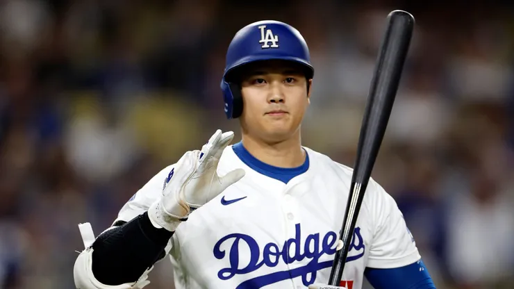 Shohei Ohtani #17 of the Los Angeles Dodgers salutes the San Diego Padres dugout as we walks up to bat during the first inning at Dodger Stadium on September 26, 2024 in Los Angeles, California.