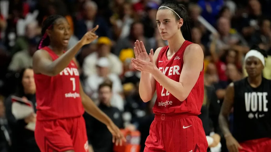 Aliyah Boston #7 and Caitlin Clark #22 of the Indiana Fever reacts as they play the Connecticut Sun during the fourth quarter of Game Two of the 2024 WNBA Playoffs first round at Mohegan Sun Arena on September 25, 2024 in Uncasville, Connecticut. (Photo by Joe Buglewicz/Getty Images)