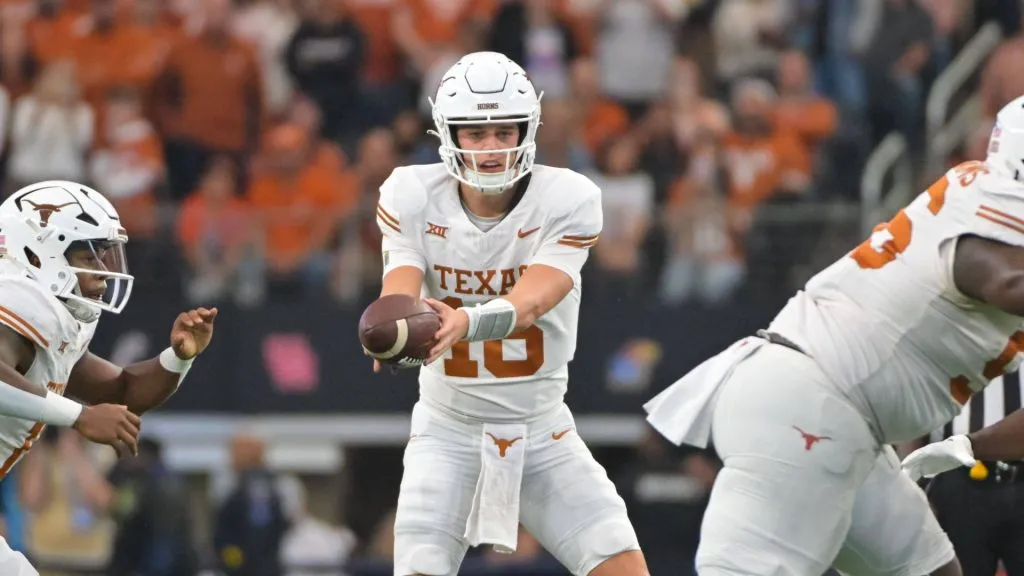Texas Longhorns quarterback Arch Manning (16) gets ready to hand the ball off during the 2nd half of the NCAA, College League, USA Football game between the Oklahoma State Cowboys and Texas Longhorns at AT&amp;T Stadium in Arlington, Texas.