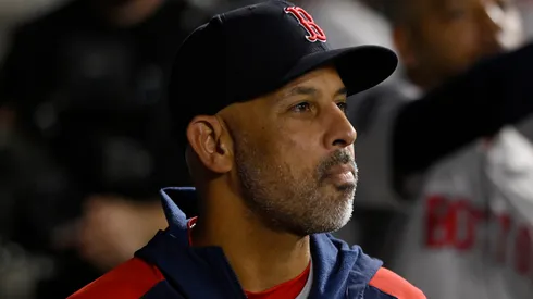 Alex Cora #13 of the Boston Red Sox looks on from the dugout in the sixth inning against the Chicago White Sox at Guaranteed Rate Field.