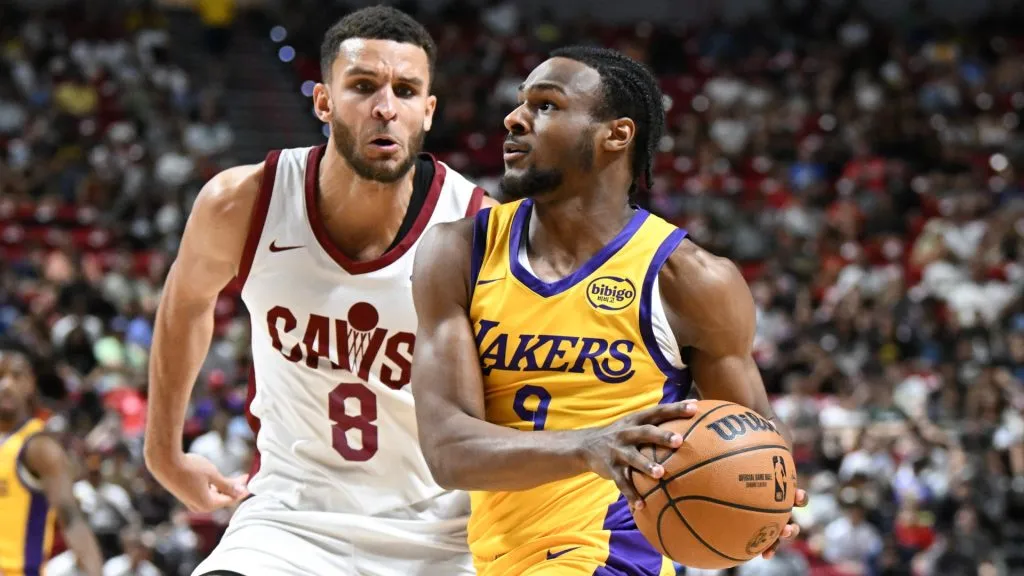 Bronny James Jr. #9 of the Los Angeles Lakers drives past Pete Nance #8 of the Cleveland Cavaliers during a 2024 NBA Summer League game at the Thomas & Mack Center. (Photo by Candice Ward/Getty Images)
