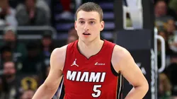 Nikola Jovic #5 of the Miami Heat handles the ball during a game against the Milwaukee Bucks at Fiserv Forum.