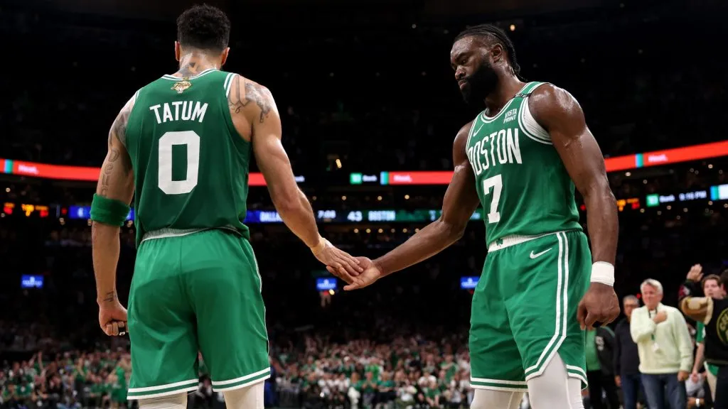 Jayson Tatum #0 high fives Jaylen Brown #7 of the Boston Celtics after a play against the Dallas Mavericks during the second quarter of Game Five of the 2024 NBA Finals at TD Garden on June 17, 2024 in Boston, Massachusetts. (Photo by Elsa/Getty Images)