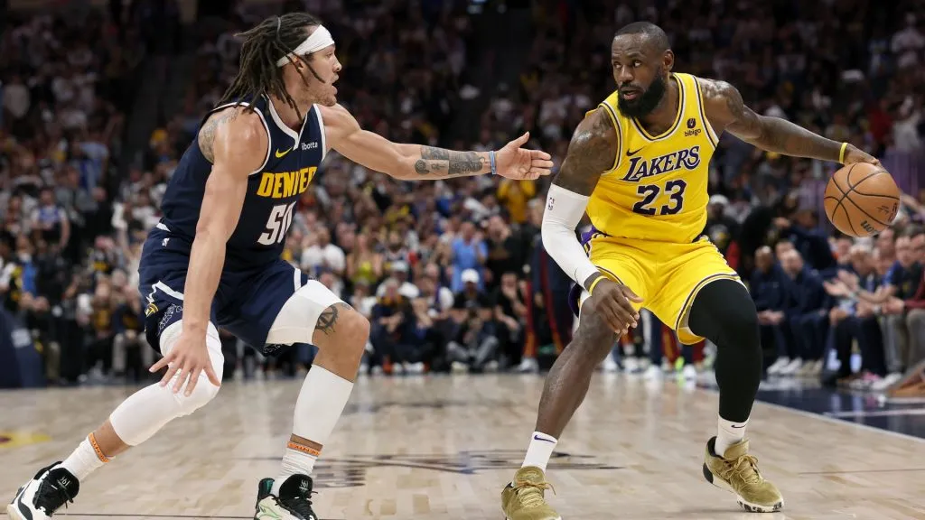 Aaron Gordon #50 of the Denver Nuggets guards LeBron James #23 of the Los Angeles Lakers in the third quarter during game five of the Western Conference First Round Playoffs at Ball Arena. (Photo by Matthew Stockman/Getty Images)