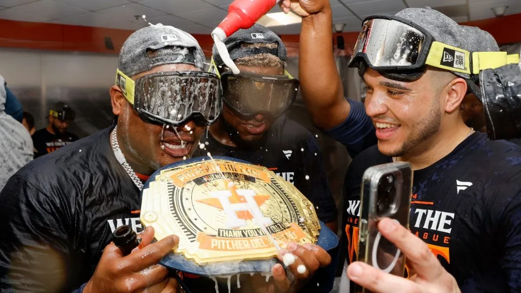 The Houston Astros celebrate in the locker room after winning the AL West Division by defeating the Seattle Mariners at Minute Maid Park on September 24, 2024 in Houston, Texas. (Photo by Tim Warner/Getty Images)