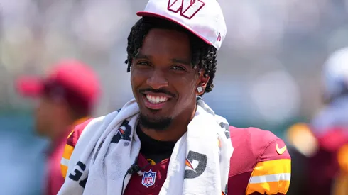 Jayden Daniels #5 of the Washington Commanders looks on against the New York Jets in the first half of the preseason game against at MetLife Stadium on August 10, 2024 in East Rutherford, New Jersey.