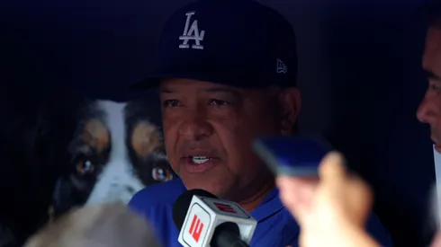 Manager Dave Roberts #30 of the Los Angeles Dodgers speaks to the media prior to facing the Atlanta Braves at Truist Park.