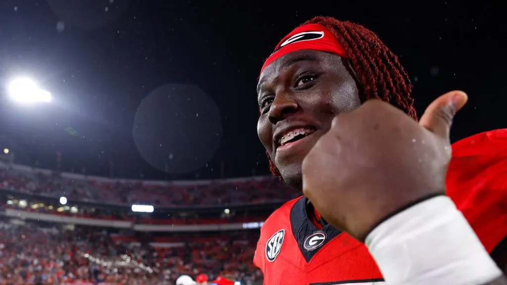 Amarius Mims #65 of the Georgia Bulldogs reacts following the 52-17 victory over the DATA: # of the Mississippi Rebels at Sanford Stadium on November 11, 2023 in Athens, Georgia.