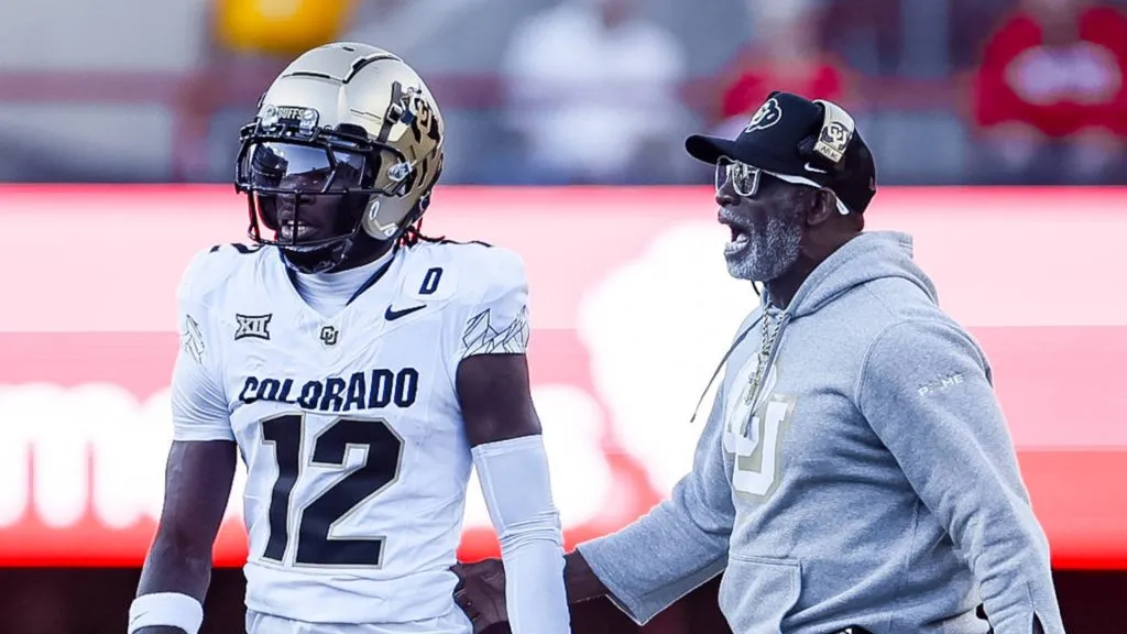 Colorado Buffaloes head coach Deion Sanders walks on to the field to talk with Colorado Buffaloes Travis Hunter 12 in action during a NCAA, College League, USA Division 1 football game between Colorado Buffalos and the Nebraska Cornhuskers at Memorial Stadium in Lincoln, NE.