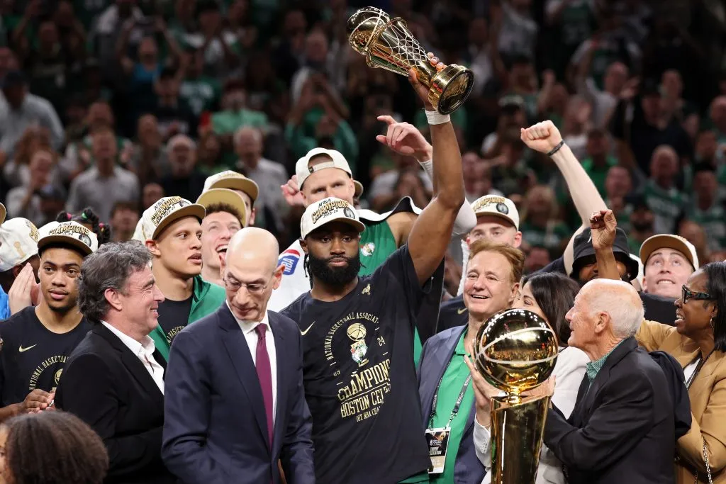 Jaylen Brown #7 of the Boston Celtics holds up the Bill Russell NBA Finals Most Valuable Player award. Elsa/Getty Images