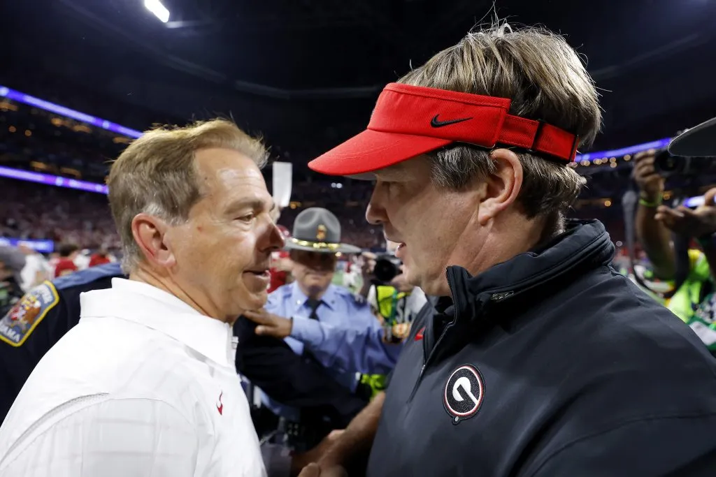 ATLANTA, GEORGIA: Head coach Nick Saban of the Alabama Crimson Tide shakes hands with Head coach Kirby Smart of the Georgia Bulldogs after defeating the Georgia Bulldogs 27-24  in the SEC Championship at Mercedes-Benz Stadium on December 02, 2023 in Atlanta, Georgia. (Photo by Todd Kirkland/Getty Images)