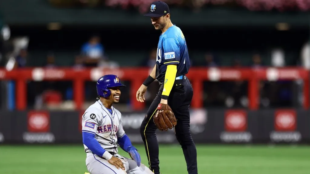 Francisco Lindor #12 of the New York Mets and Trea Turner #7 of the Philadelphia Phillies speak during the fifth inning at Citizens Bank Park on September 13, 2024 in Philadelphia, Pennsylvania. (Photo by Tim Nwachukwu/Getty Images)