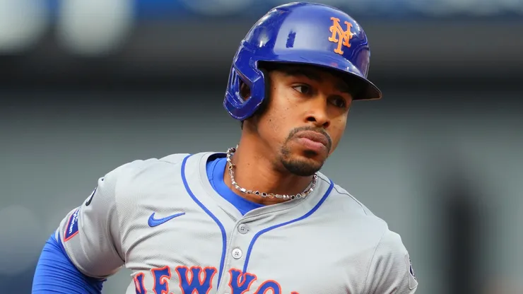 Francisco Lindor #12 of the New York Mets rounds the bases on his home run against the Toronto Blue Jays during the ninth inning in their MLB game.