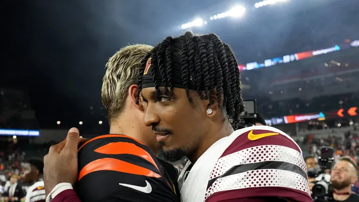 Jayden Daniels #5 of the Washington Commanders hugs Joe Burrow #9 of the Cincinnati Bengals after the game at Paycor Stadium on September 23, 2024 in Cincinnati, Ohio.