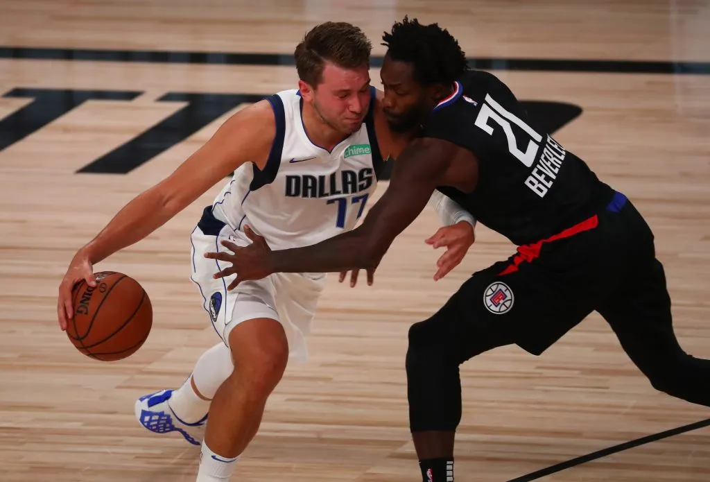 Luka Doncic #77 of the Dallas Mavericks drives against Patrick Beverley #21 of the LA Clippers. Kim Klement-Pool/Getty Images