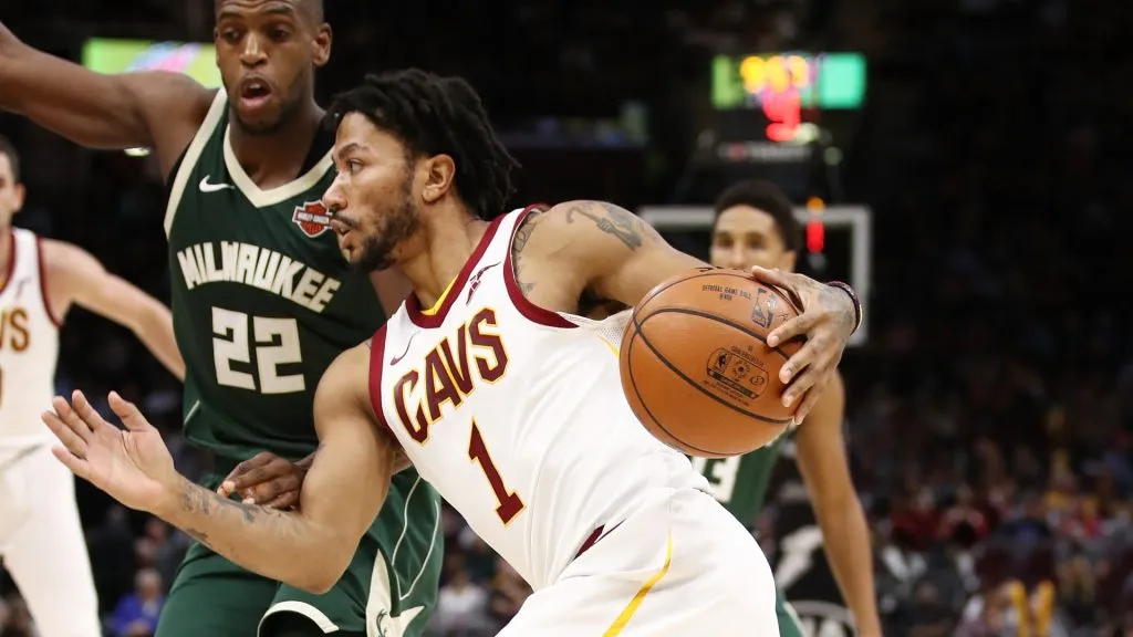 Derrick Rose #1 of the Cleveland Cavaliers drives around Khris Middleton #22 of the Milwaukee Bucks during the second half at Quicken Loans Arena on November 7, 2017 in Cleveland, Ohio. Cleveland won the game 124-119.