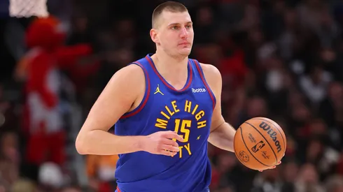 Nikola Jokic #15 of the Denver Nuggets dribbles up the court against the Chicago Bulls