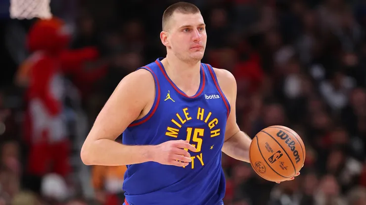 Nikola Jokic #15 of the Denver Nuggets dribbles up the court against the Chicago Bulls