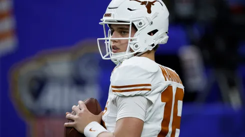 Arch Manning #16 of the Texas Longhorns warms up prior to playing against the Washington Huskies during the CFP Semifinal Allstate Sugar Bowl at Caesars Superdome on January 01, 2024 in New Orleans, Louisiana.