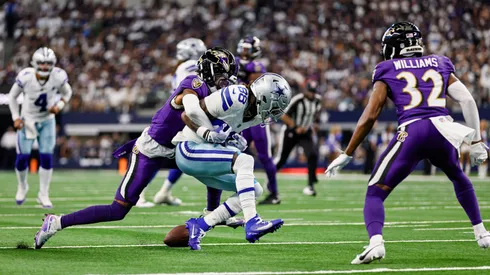 Baltimore Ravens cornerback Nate Wiggins (2) knocks the ball loose from Dallas Cowboys wide receiver CeeDee Lamb (88) for a fumble during the game between the Dallas Cowboys and the Baltimore Ravens on September 22, 2024 at AT&T Stadium in Arlington, Texas. (Photo by Matthew Pearce/Icon Sportswire)