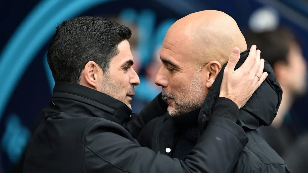 Mikel Arteta, Manager of Arsenal, interacts with Pep Guardiola, Manager of Manchester City, prior to the Premier League match between Manchester City and Arsenal FC at Etihad Stadium on March 31, 2024 in Manchester, England. 