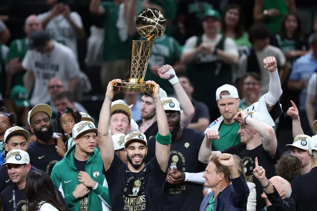 Jayson Tatum #0 of the Boston Celtics lifts the Larry O’Brien Championship Trophy. Adam Glanzman/Getty Images