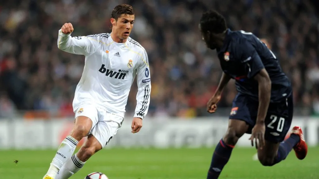 Cristiano Ronaldo (L) of Real Madrid is challenged by Aly Cissokho of Olympique Lyonnais during the UEFA Champions League round of 16 2nd leg match between Real Madrid and Olympique Lyonnais at Estadio Santiago Bernabeu on March 10, 2010 in Madrid, Spain.