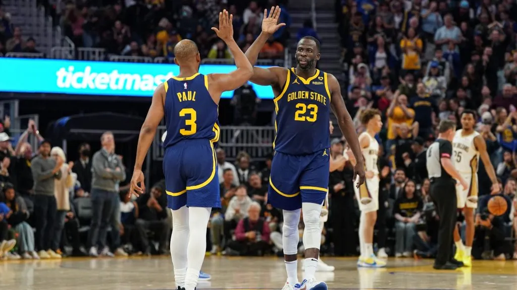 Chris Paul #3 and Draymond Green #23 of the Golden State Warriors celebrate a made basket in the fourth quarter against the New Orleans Pelicans at Chase Center. (Photo by Kavin Mistry/Getty Images)