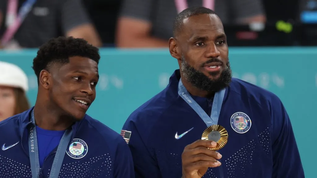Anthony Edwards and LeBron James pose with their medals on the podium during the Men’s basketball medal ceremony on day fifteen of the Olympic Games Paris 2024 at Bercy Arena. (Photo by Jamie Squire/Getty Images)