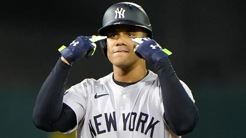 Juan Soto #22 of the New York Yankees stands on second base as he celebrates a pinch-hit RBI double scoring Oswaldo Cabrera #95 (not in the image) against the Oakland Athletics in the top of the 10th inning at the Oakland Coliseum on September 20, 2024 in Oakland, California.