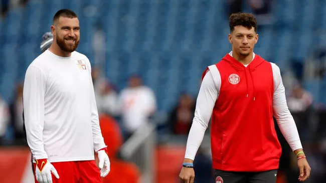 Travis Kelce #87 and Patrick Mahomes #15 of the Kansas City Chiefs look on prior to a game against the New England Patriots at Gillette Stadium on December 17, 2023 in Foxborough, Massachusetts. (Photo by Sarah Stier/Getty Images)