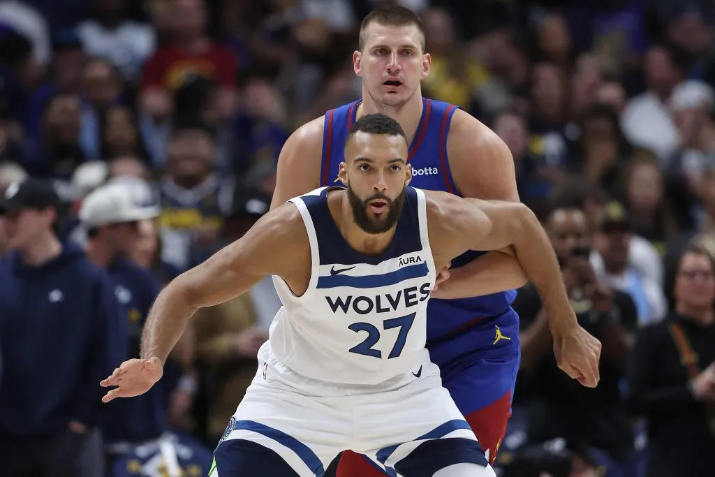 Nikola Jokic #15 of the Denver Nuggets guards Rudy Gobert #27 of the Minnesota Timberwolves. Matthew Stockman/Getty Images
